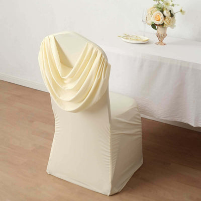 Elegant cream chair cover draped for a stylish dining setup.