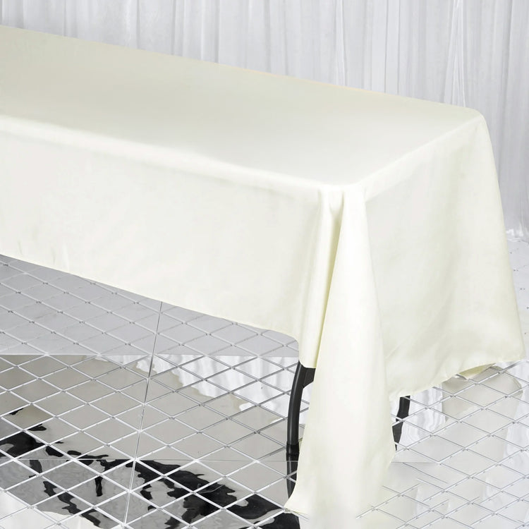Seamless 60 Inch x 126 Inch Ivory Premium 190 GSM Polyester Rectangular Tablecloth