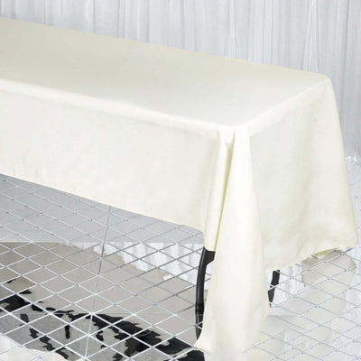 Ivory tablecloth draped over a table in a studio setting.