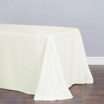 Enhance Your Event Decor with the Ivory Seamless Premium Polyester Rectangular Tablecloth