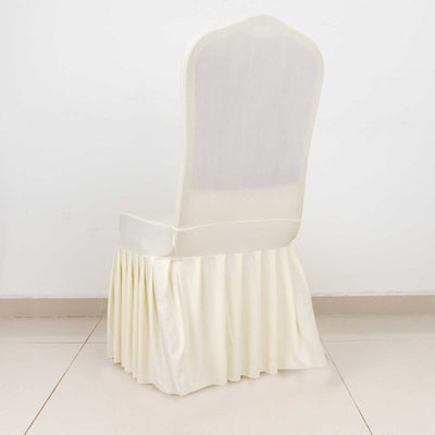 Elegant cream chair with pleated skirt, perfect for events or weddings.