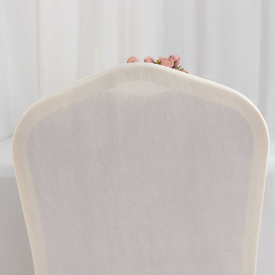 Elegant chair with a soft, curved backrest on a white backdrop