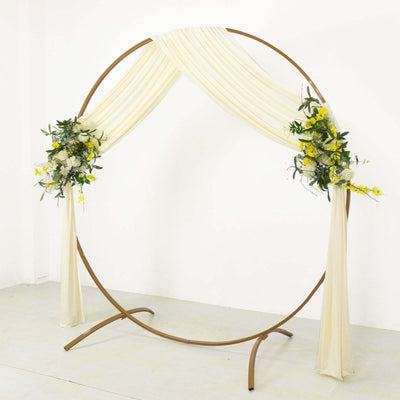 Elegant wedding arch with draped fabric and floral arrangements
