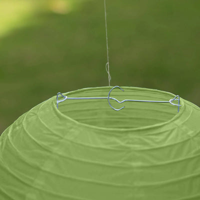 Green hanging lantern with metal hook.