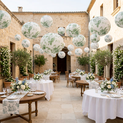 Elegant outdoor wedding setup with floral arrangements and decorative lanterns.