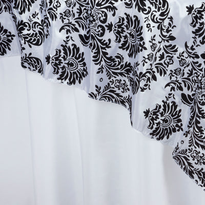 Black and white damask fabric draped elegantly.