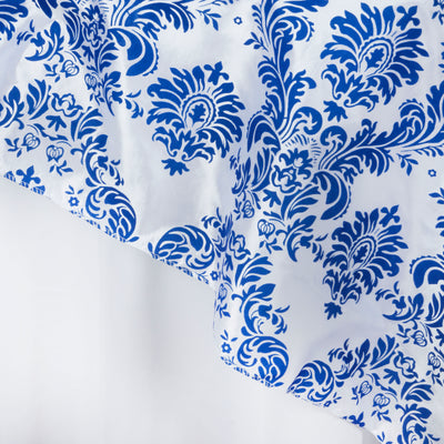 Blue floral patterned fabric draped elegantly on a white background.