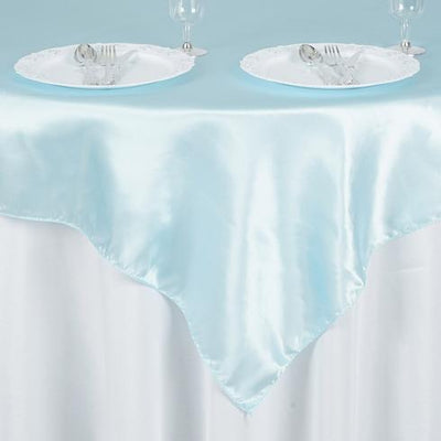 Light blue satin tablecloth draped elegantly over a white table.