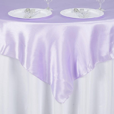 Purple satin tablecloth draped elegantly over a white table.