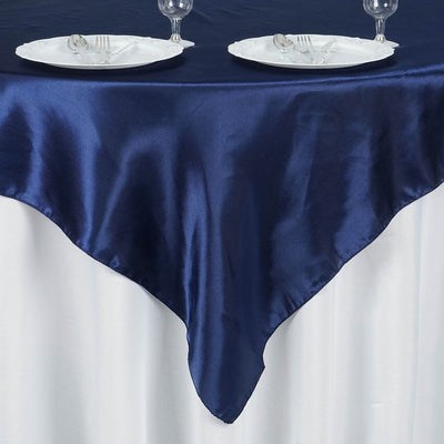 Navy satin tablecloth draped elegantly over a white table