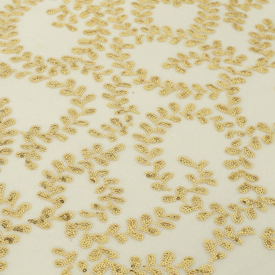 Gold embroidered leaf pattern on cream fabric.