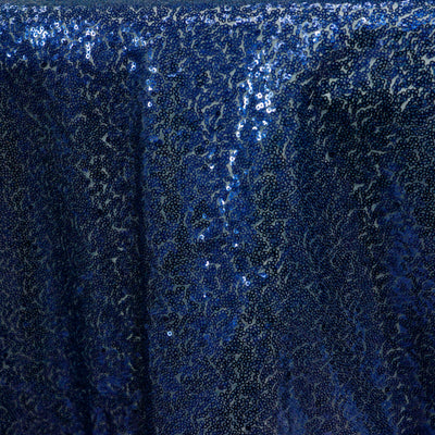 Blue sequin fabric with shimmering textures and patterns.