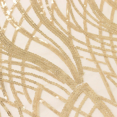 Gold sequin fabric with intricate pattern and textured design.