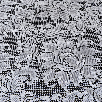 White lace fabric with intricate floral patterns.