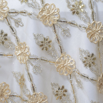 Embroidered floral fabric with gold thread and sequins.