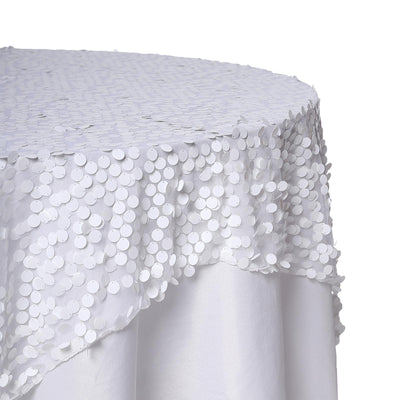White tablecloth with sequin details, elegantly draped.