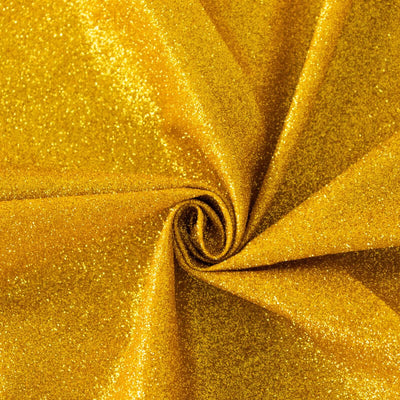 Shiny gold glitter fabric swirl texture close-up.