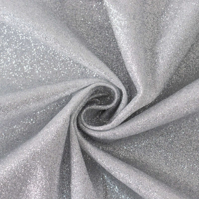 Sparkling silver glitter fabric in a swirling pattern.