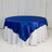Round blue satin tablecloth draped over a white table.