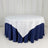 Round table with a white and navy blue tablecloth