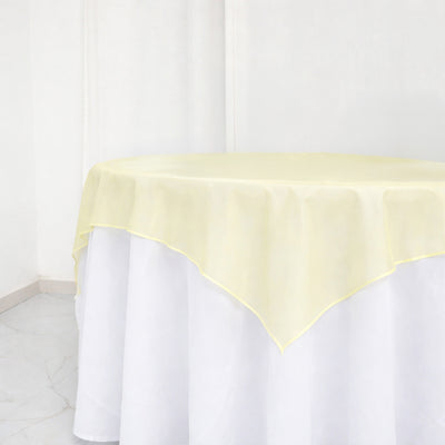 Yellow tablecloth overlay on a white table