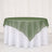 Green sheer overlay round tablecloth on white banquet table