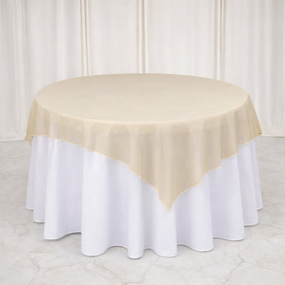 Ivory table overlay on a round white tablecloth