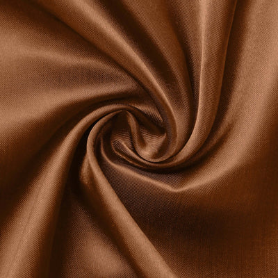 Brown satin fabric in a swirling pattern showcasing its smooth texture.
