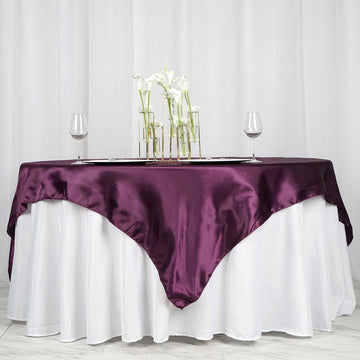 Elevate Your Event with the Eggplant Seamless Satin Square Tablecloth Overlay