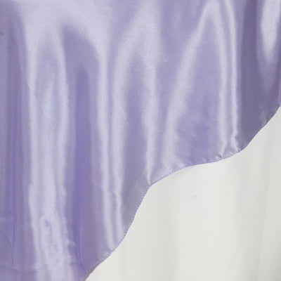 Lavender satin fabric draped elegantly against a white backdrop.