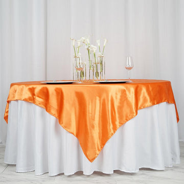 Add a Touch of Elegance with the Orange Seamless Satin Square Tablecloth Overlay
