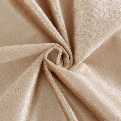 Close-up of soft, luxurious beige fabric texture.
