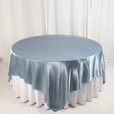 Round satin tablecloth in soft blue on a white table