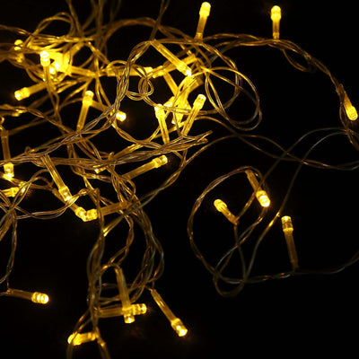 Warm white LED fairy lights on a dark background.
