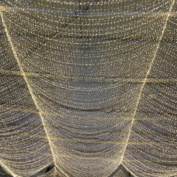 Decorative string lights hanging overhead in a festive arrangement.
