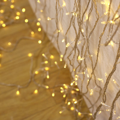Warm white string lights cascading elegantly on a surface.