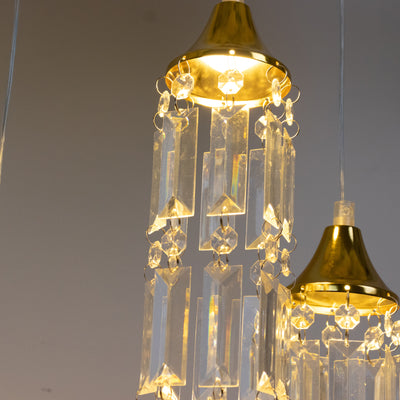 Elegant chandelier with crystal prisms and gold accents.