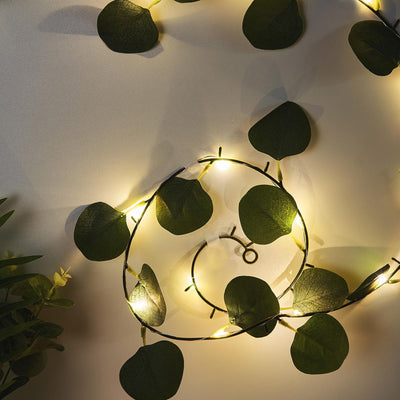 Eucalyptus leaf string lights on a neutral background