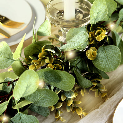Artificial greenery garland with eucalyptus leaves and fairy lights