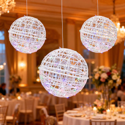 Hanging decorative light orbs for elegant event ambiance.