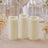 Set of three ivory flameless LED pillar candles on a floral table setting