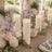 Elegant candlelit floral table setting with pastel blooms and ivory pillar candles