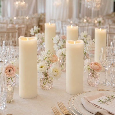 Elegant wedding table with candles, blush flowers, and crystal glassware