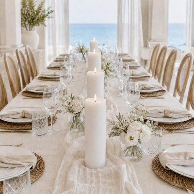 Elegant beachside dining table with candles, flowers, and ocean view