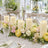 Elegant wedding table centerpiece with candles and pastel flowers