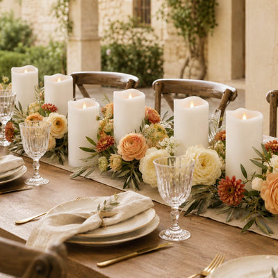 Elegant outdoor dining table with candles and floral centerpiece