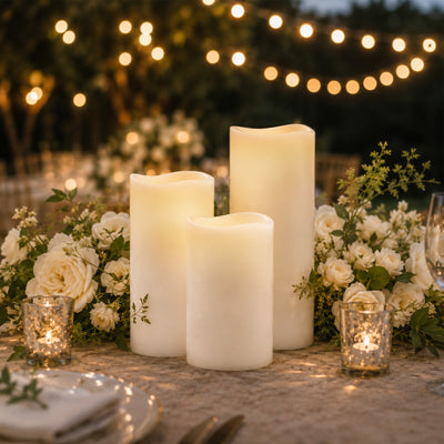Elegant candlelit wedding table with white flowers and string lights