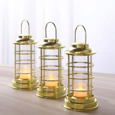 Set of three decorative gold lanterns with LED candles.