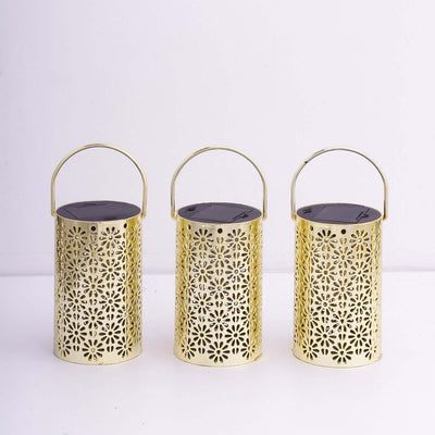 Gold decorative lanterns with intricate cut-out designs