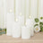 Set of five white ribbed candles with warm LED flames
